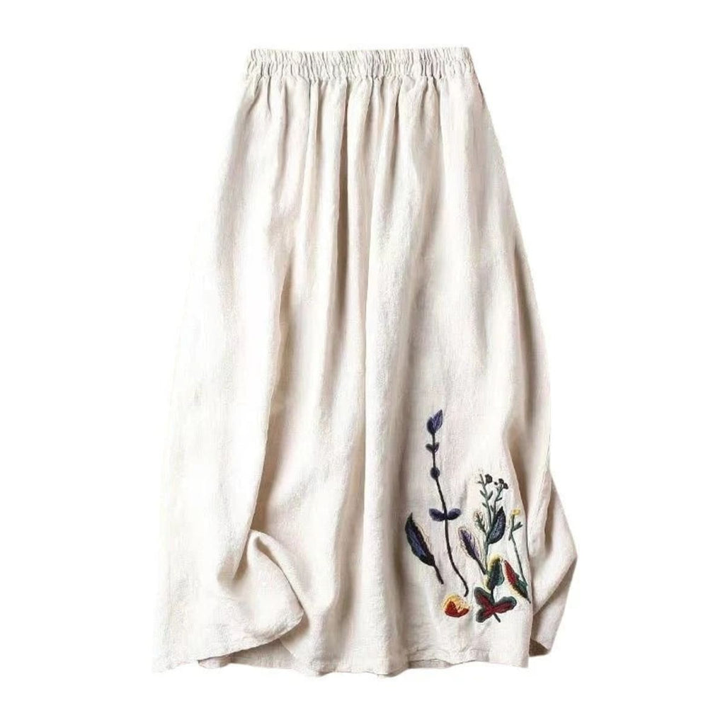 Person wears a loose-fitting midi skirt with floral embroidery.