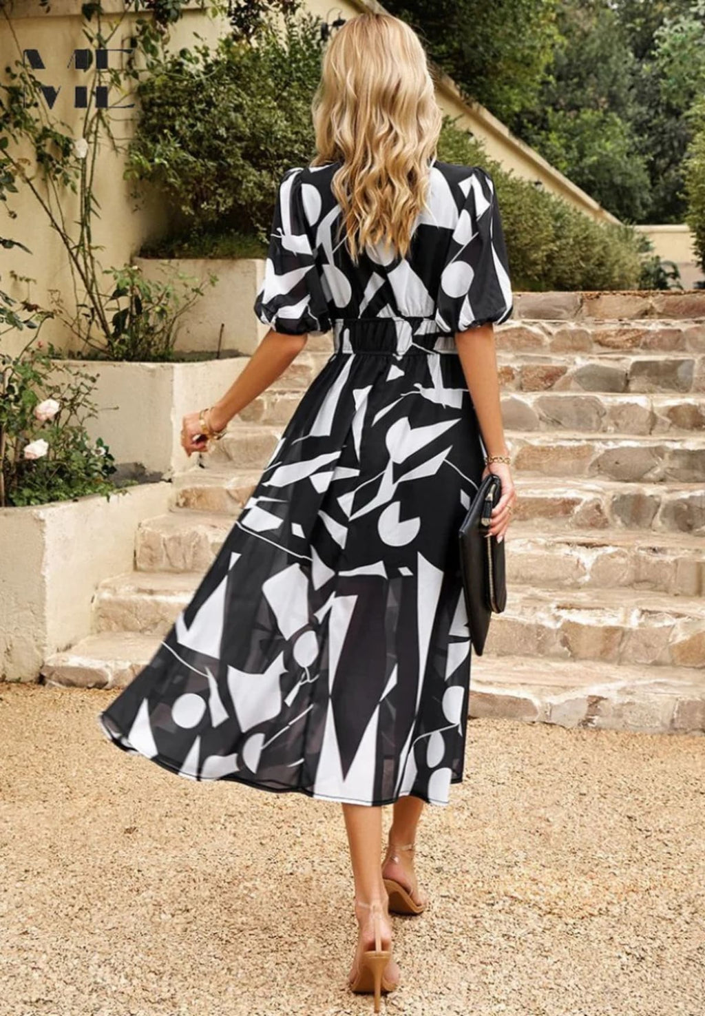 Women's A-line dress with floral print in lightweight fabric.