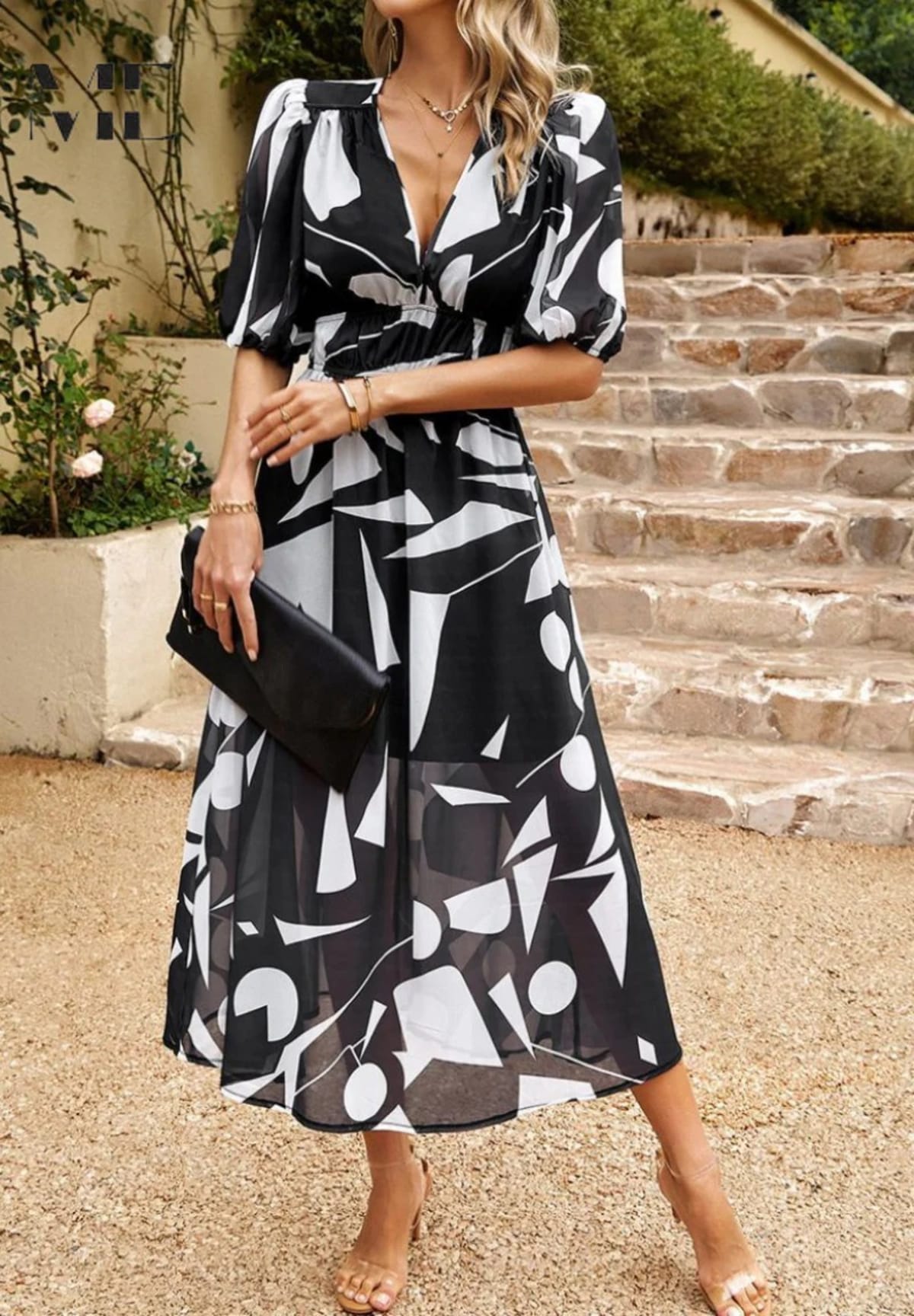 Women's A-line dress with floral print in lightweight fabric.