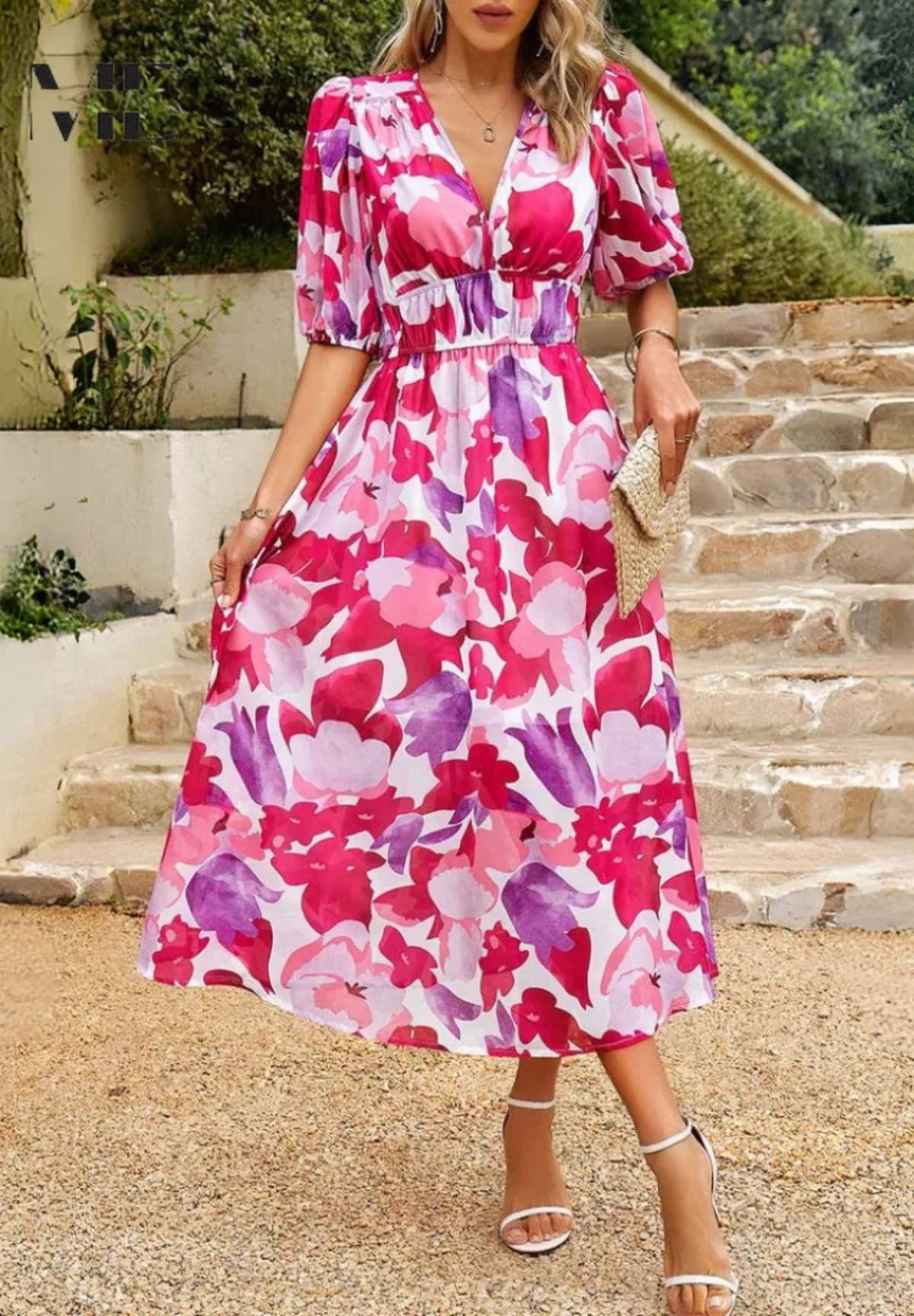 Women's A-line dress with floral print in lightweight fabric.