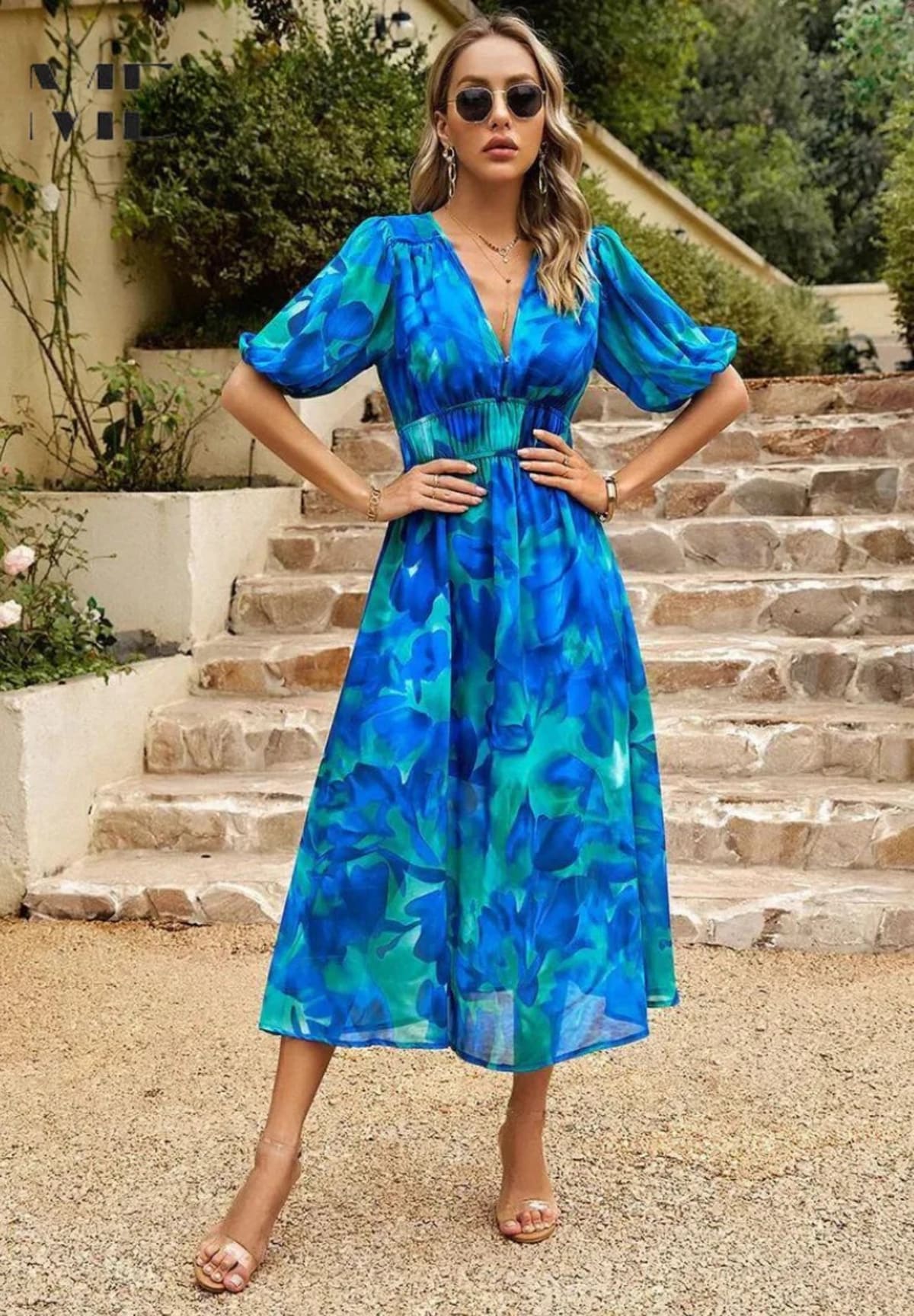 Women's A-line dress with floral print in lightweight fabric.