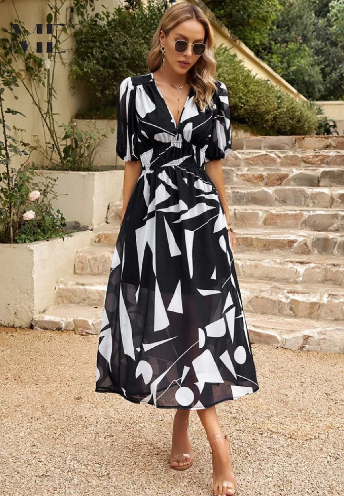Women's A-line dress with floral print in lightweight fabric.