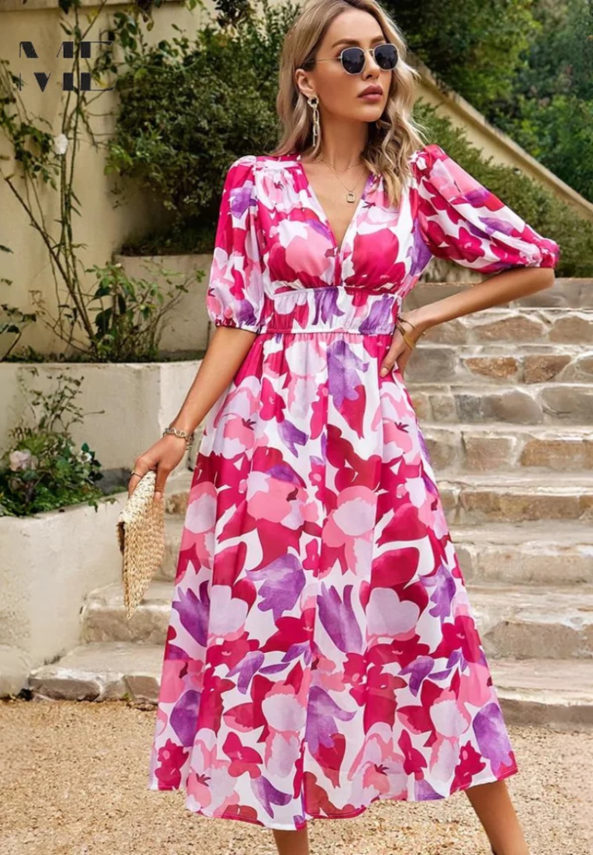 Women's A-line dress with floral print in lightweight fabric.