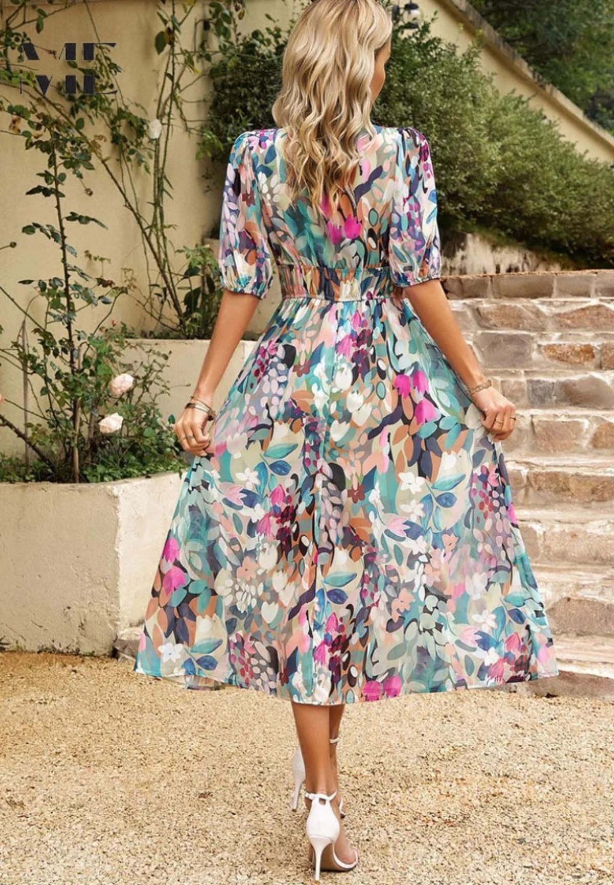 Women's A-line dress with floral print in lightweight fabric.