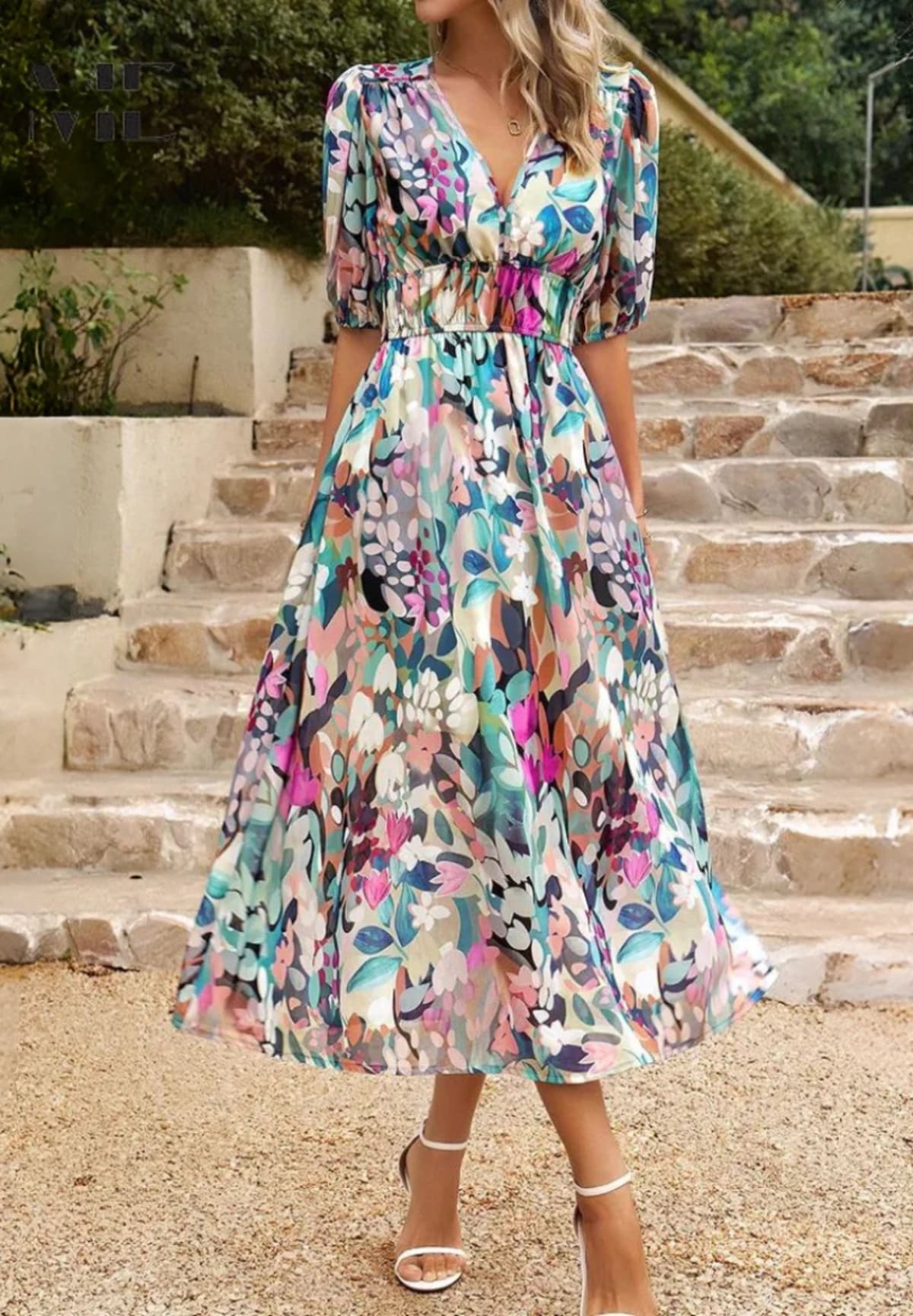 Women's A-line dress with floral print in lightweight fabric.