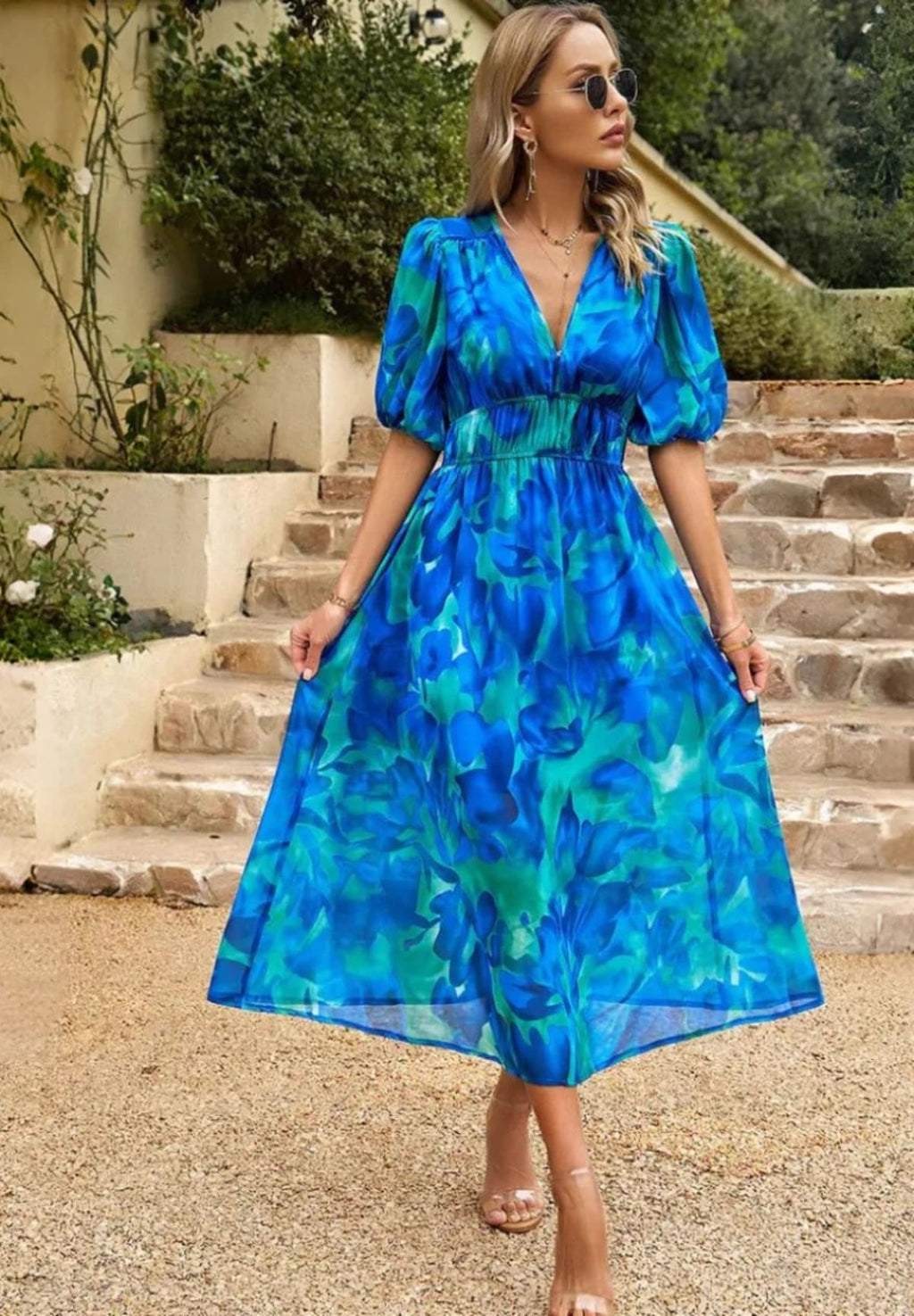 Women's A-line dress with floral print in lightweight fabric.