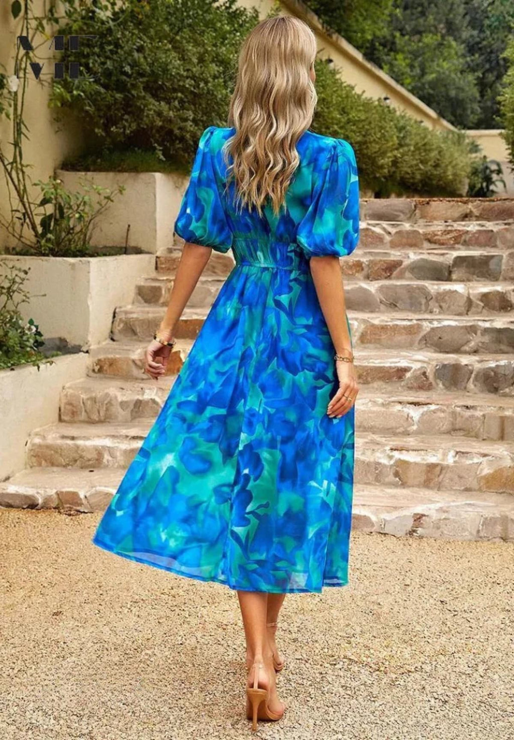 Women's A-line dress with floral print in lightweight fabric.
