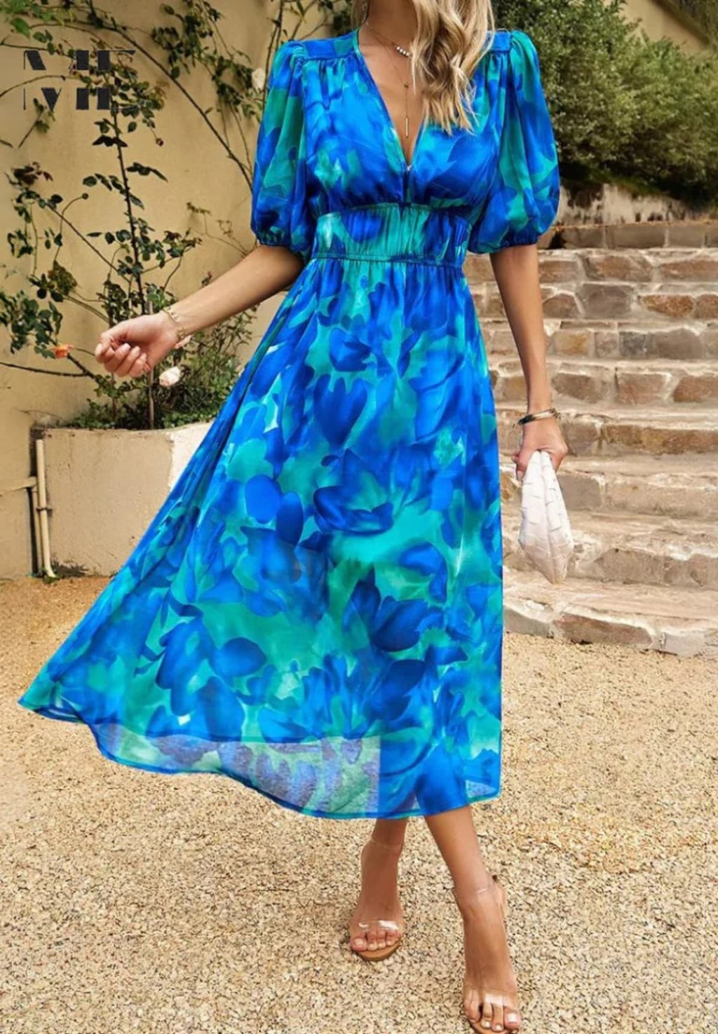 Women's A-line dress with floral print in lightweight fabric.