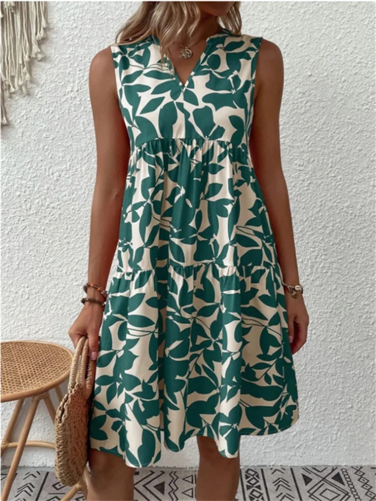Flowy summer dress with defined waist and soft drape.