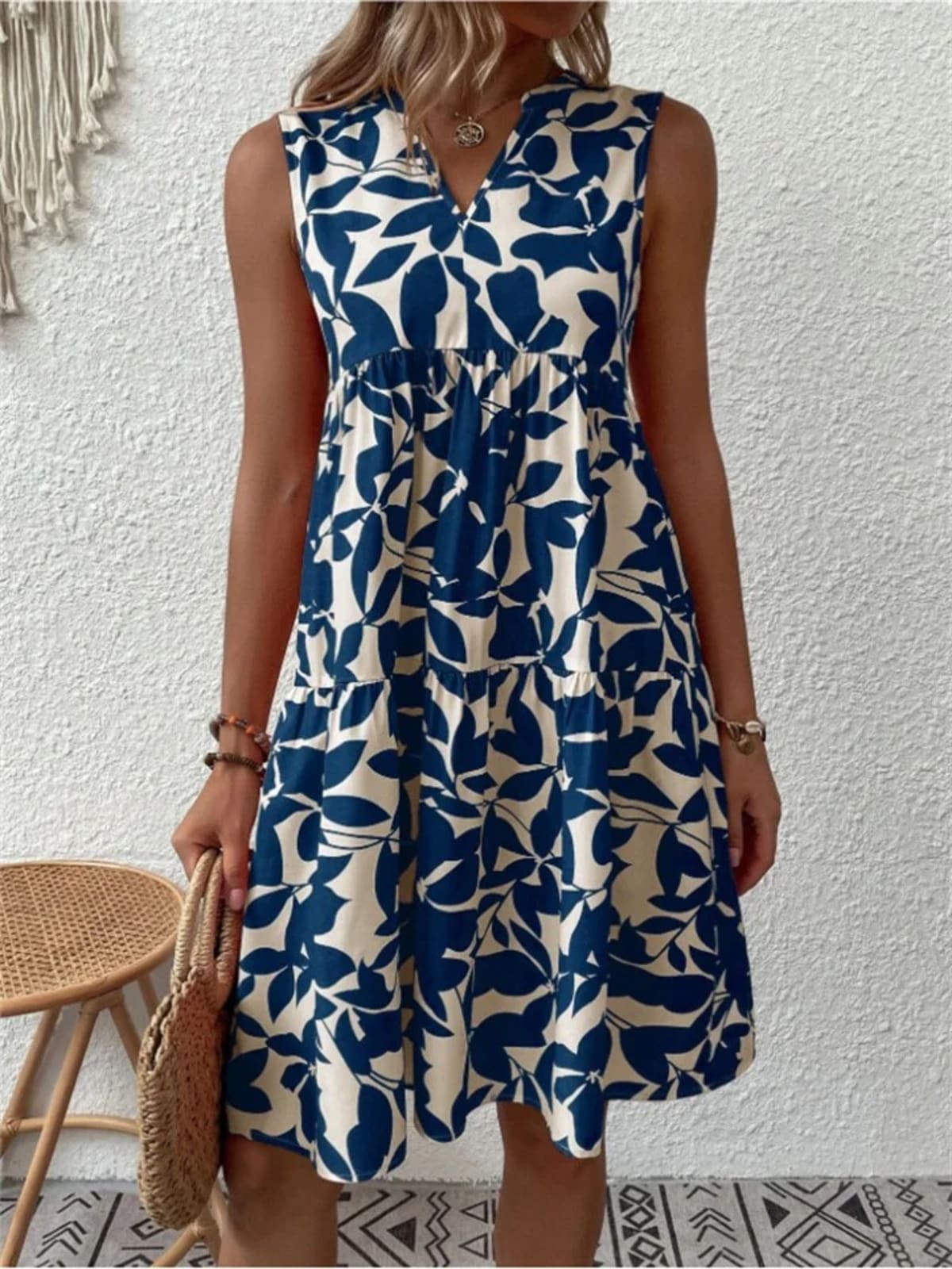Flowy summer dress with defined waist and soft drape.