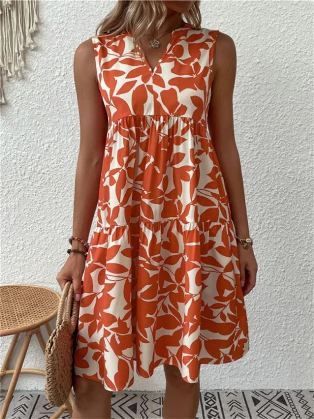 Flowy summer dress with defined waist and soft drape.