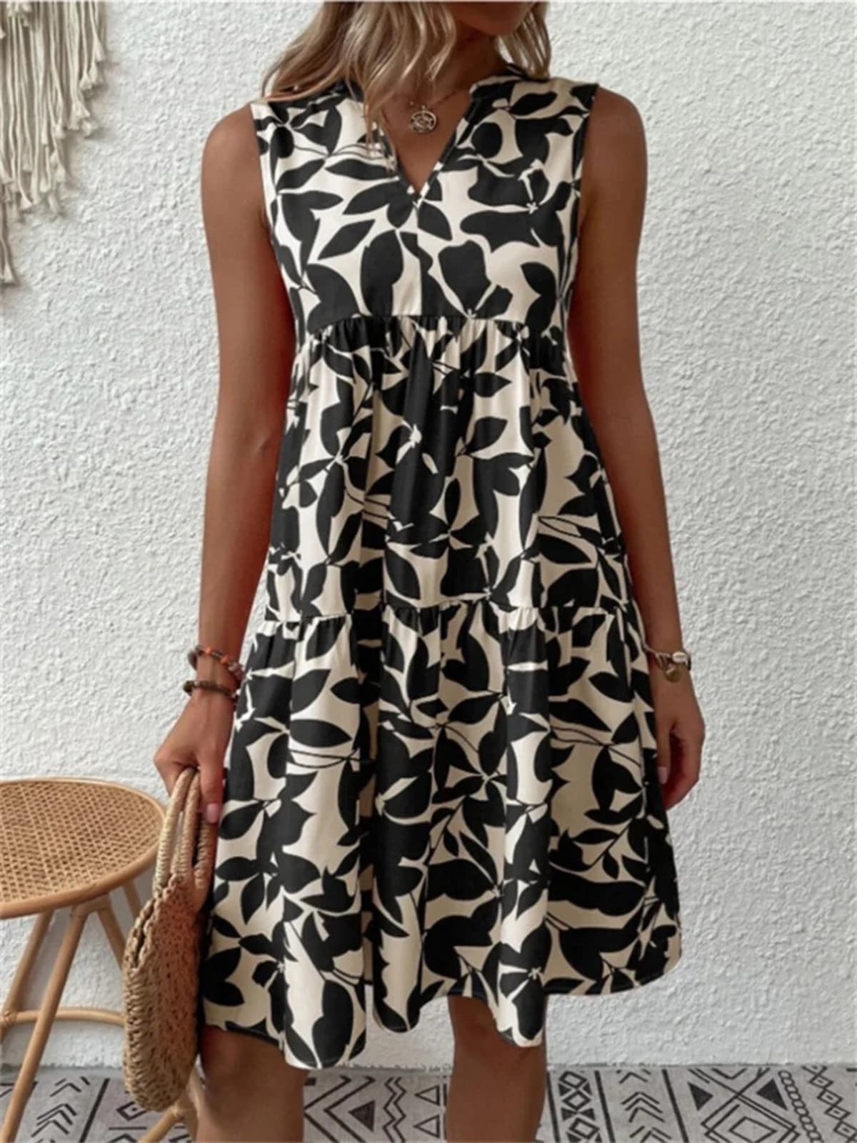 Flowy summer dress with defined waist and soft drape.