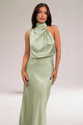Halter neck evening dress with sleek silhouette and flowing fit.