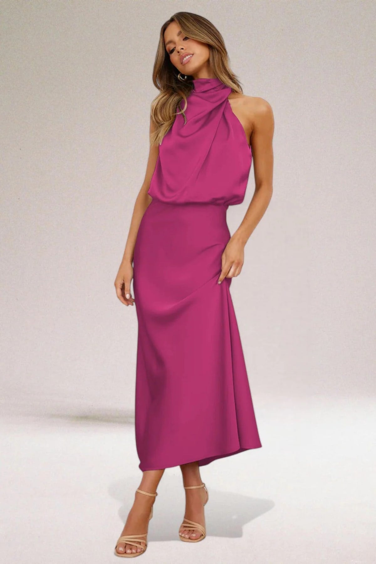 Halter neck evening dress with sleek silhouette and flowing fit.