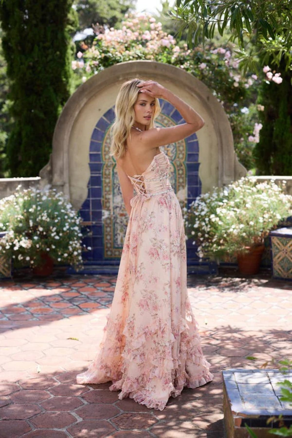 Halter neck dress with puff skirt and corset back.