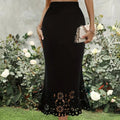 Black high-waisted maxi skirt with floral laser-cut hem.