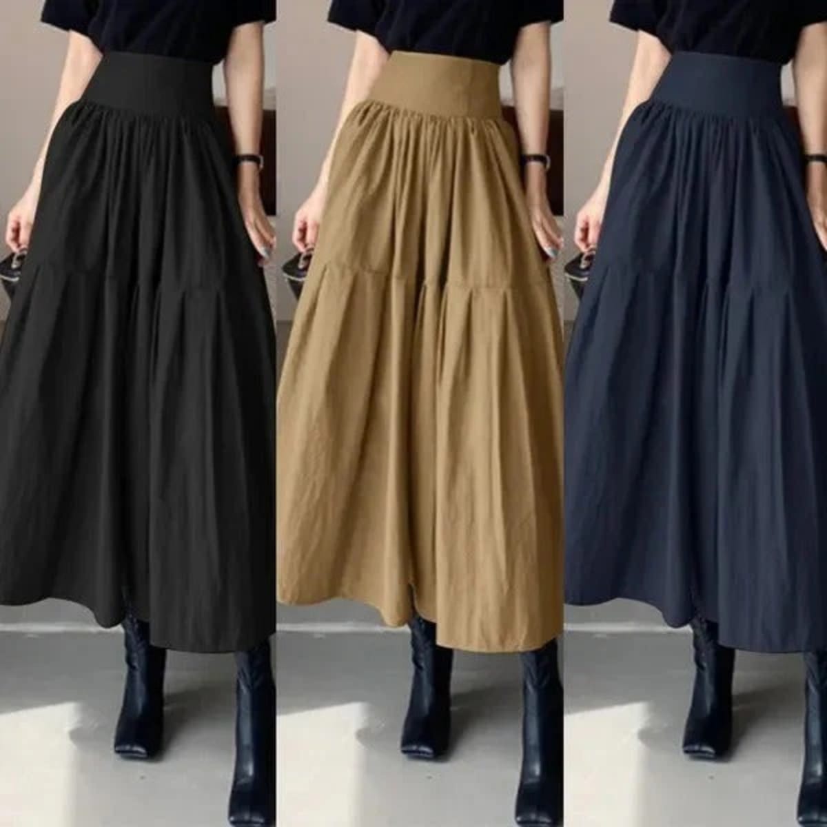 Woman wearing high-waisted pleated tiered midi skirt with black top.