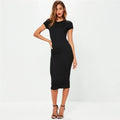 Woman in a ribbed midi bodycon dress with crew neck and short sleeves.