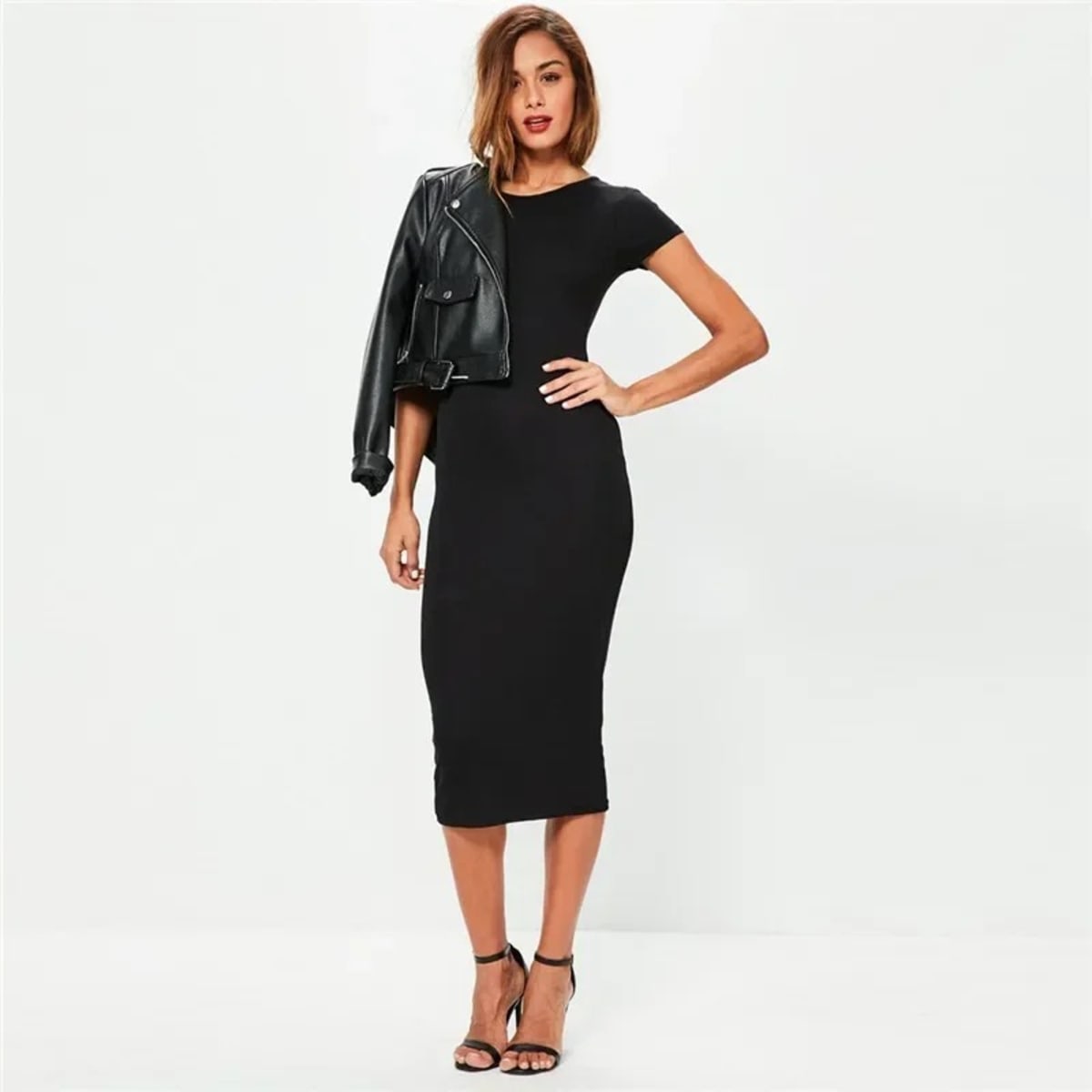 Woman in a ribbed midi bodycon dress with crew neck and short sleeves.