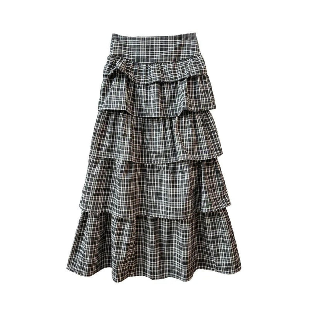 Woman wearing a plaid tiered maxi skirt outdoors