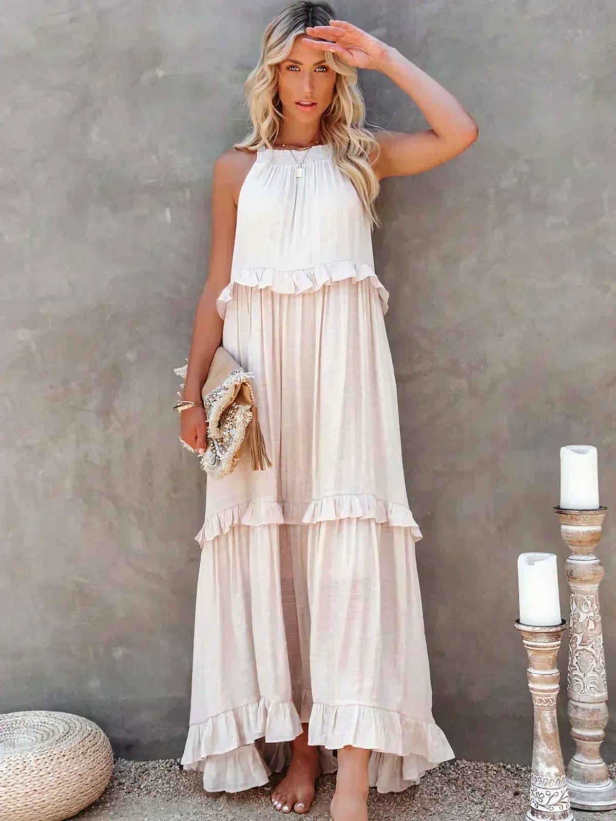 Sleeveless dress with ruffles, flowing fit, suitable for various occasions.