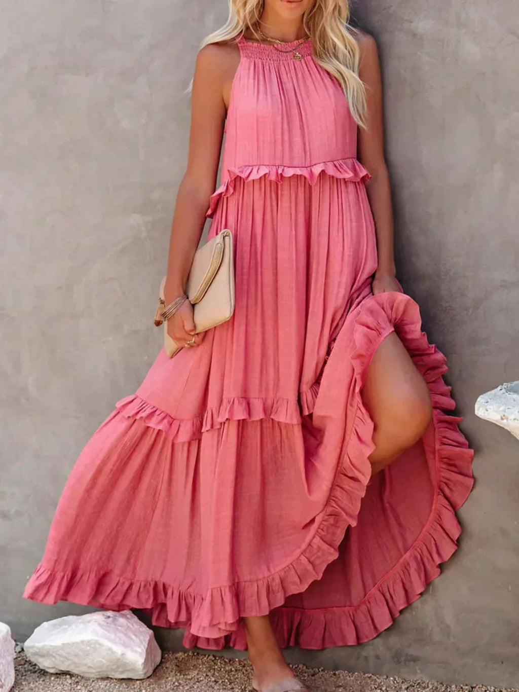 Sleeveless dress with ruffles, flowing fit, suitable for various occasions.