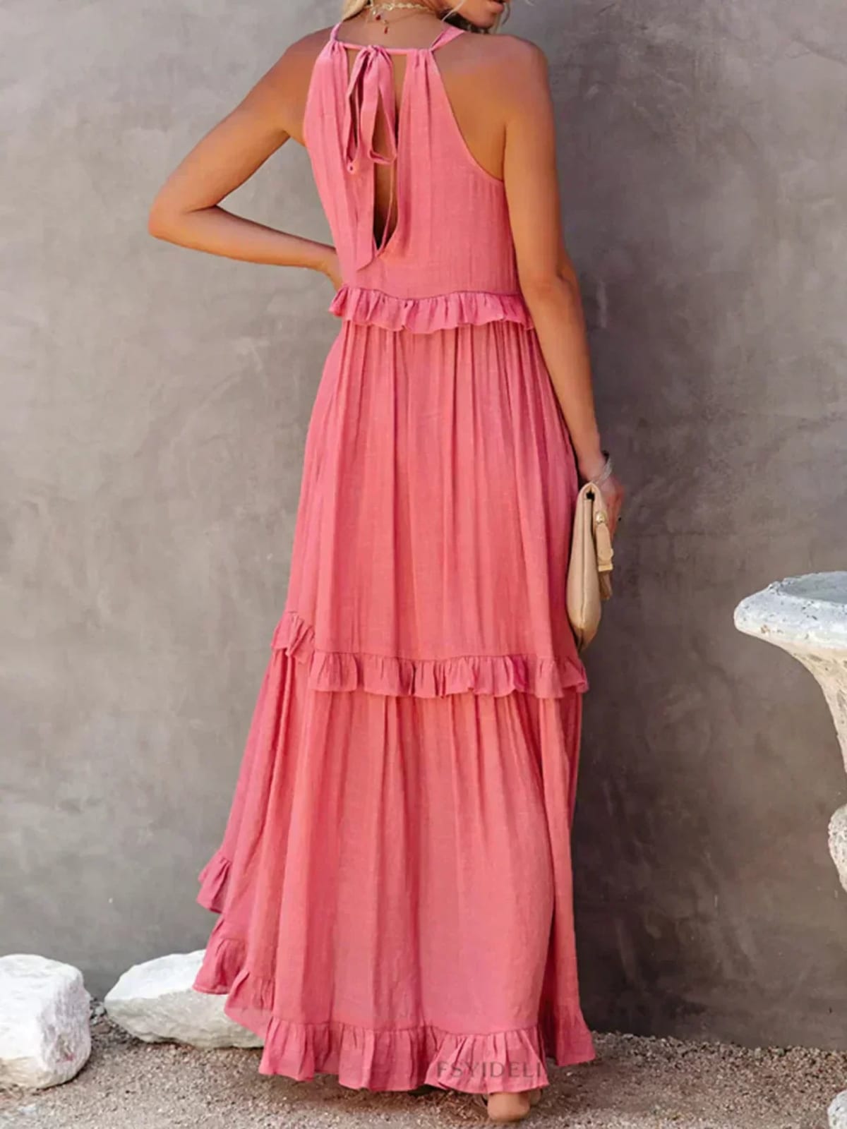 Sleeveless dress with ruffles, flowing fit, suitable for various occasions.