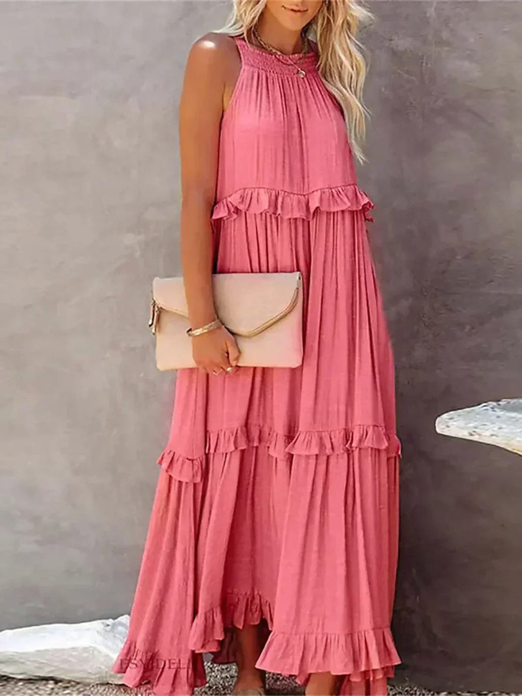 Sleeveless dress with ruffles, flowing fit, suitable for various occasions.