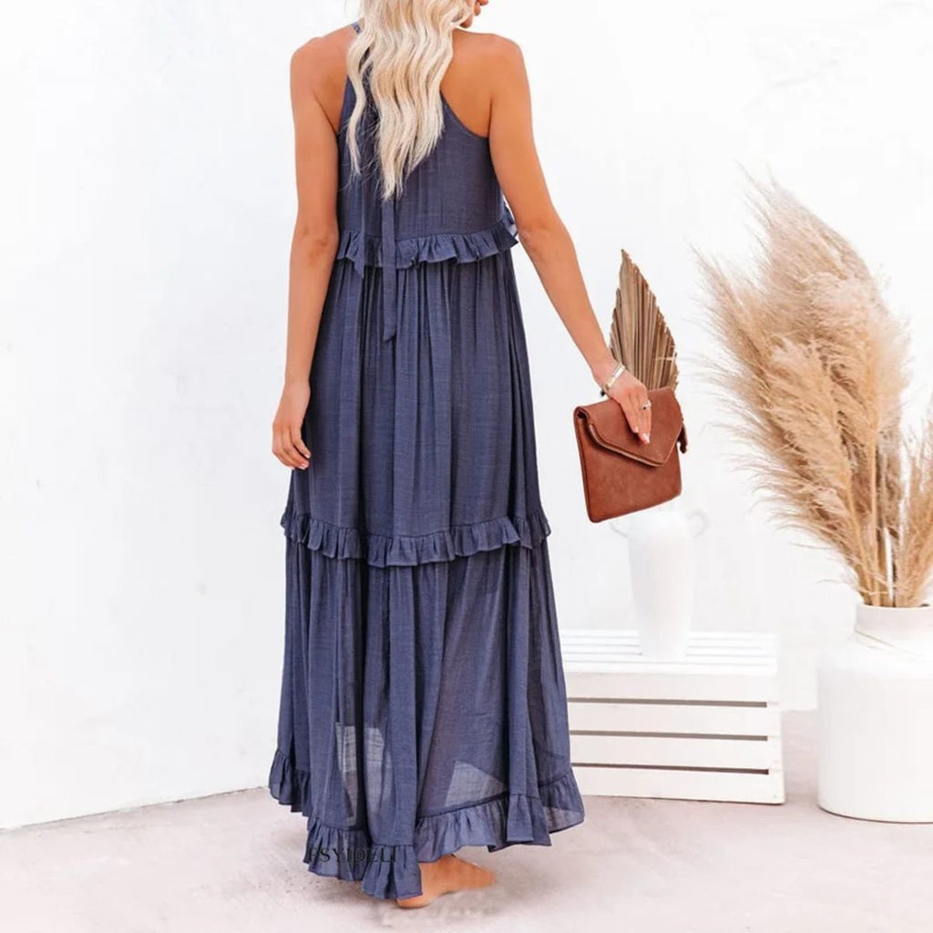 Sleeveless dress with ruffles, flowing fit, suitable for various occasions.
