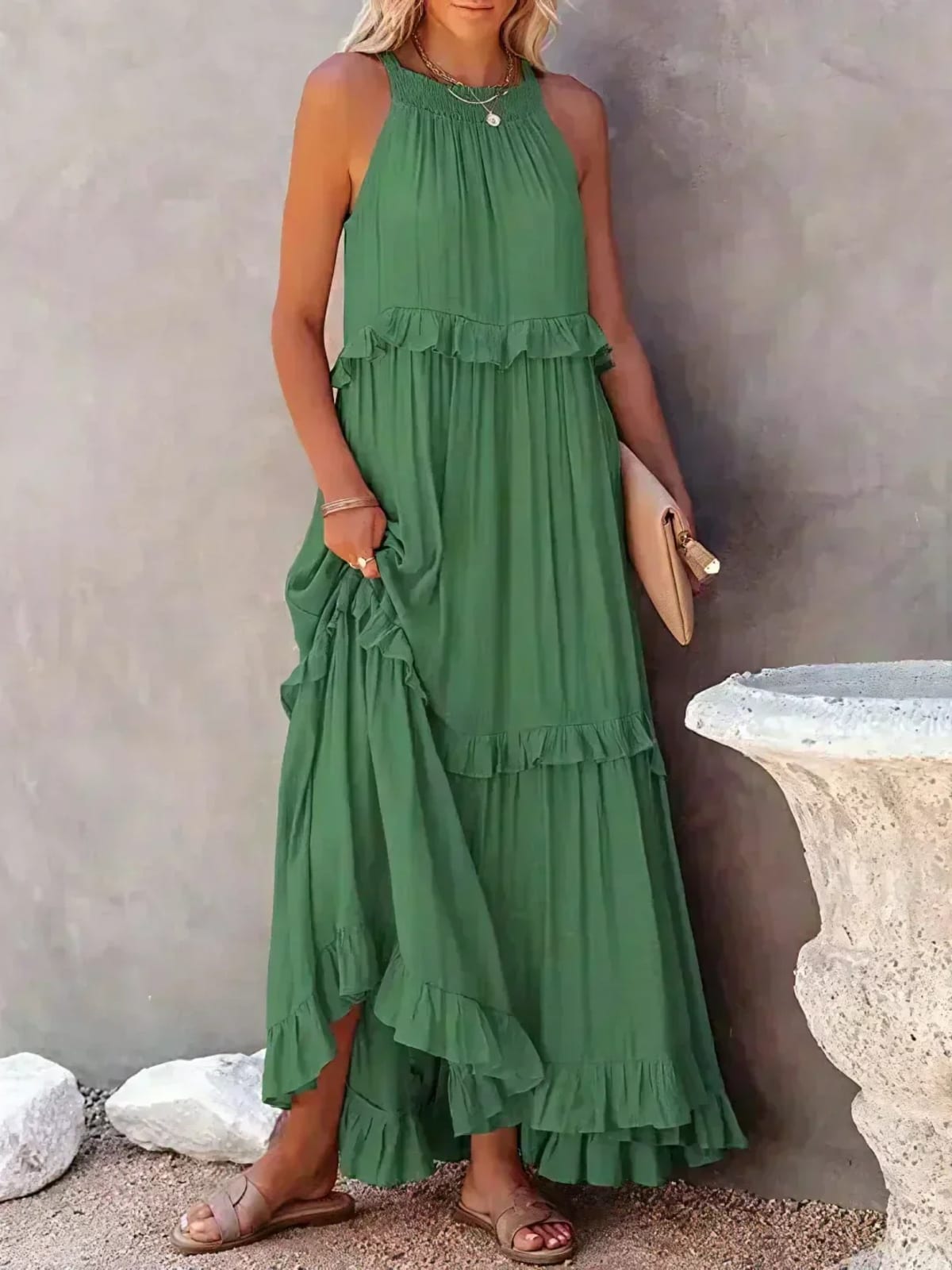 Sleeveless dress with ruffles, flowing fit, suitable for various occasions.