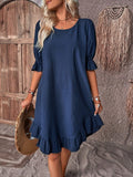 Woman wearing a relaxed fit ruffle summer dress