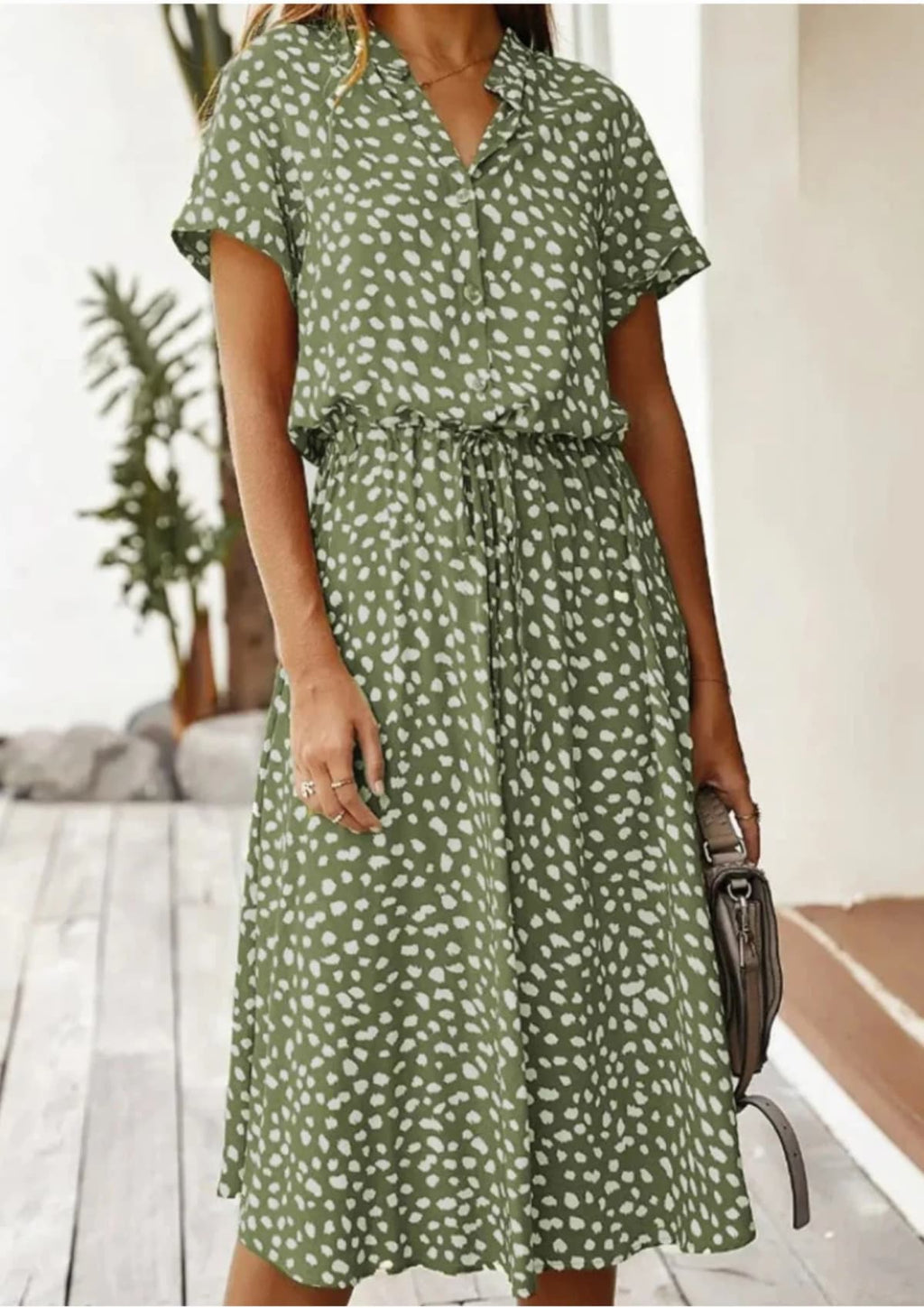 Spotted midi dress with button-down front and drawstring waist.