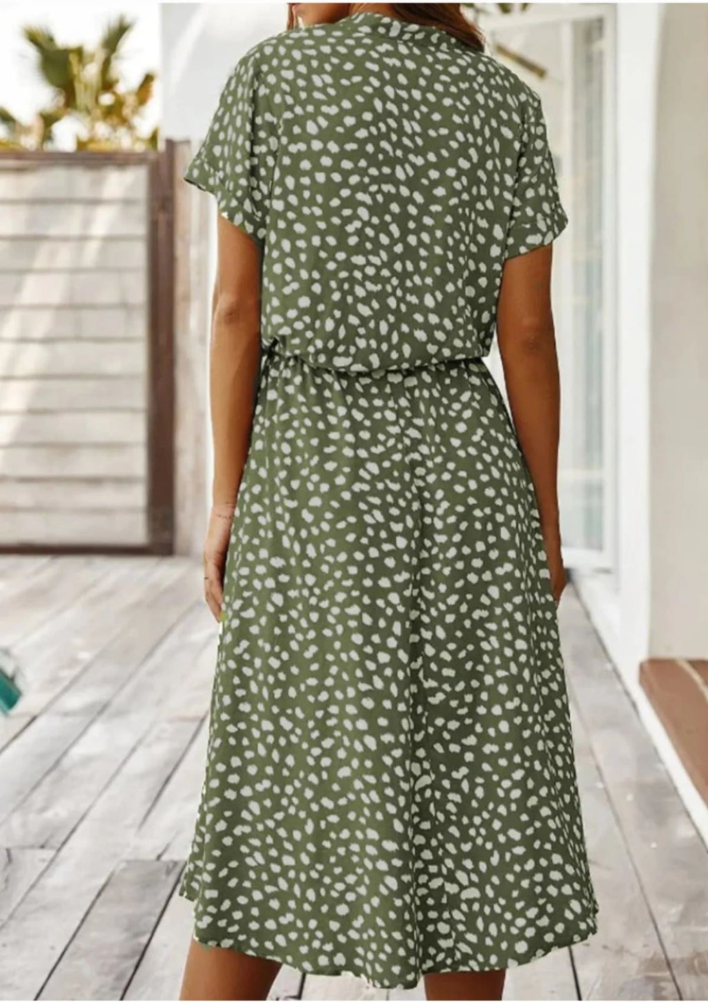 Spotted midi dress with button-down front and drawstring waist.