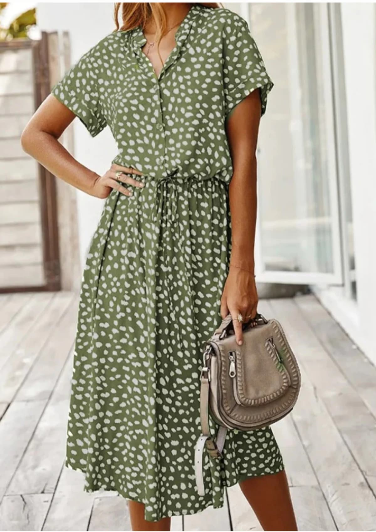 Spotted midi dress with button-down front and drawstring waist.