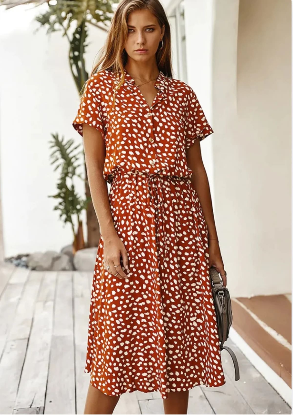 Spotted midi dress with button-down front and drawstring waist.