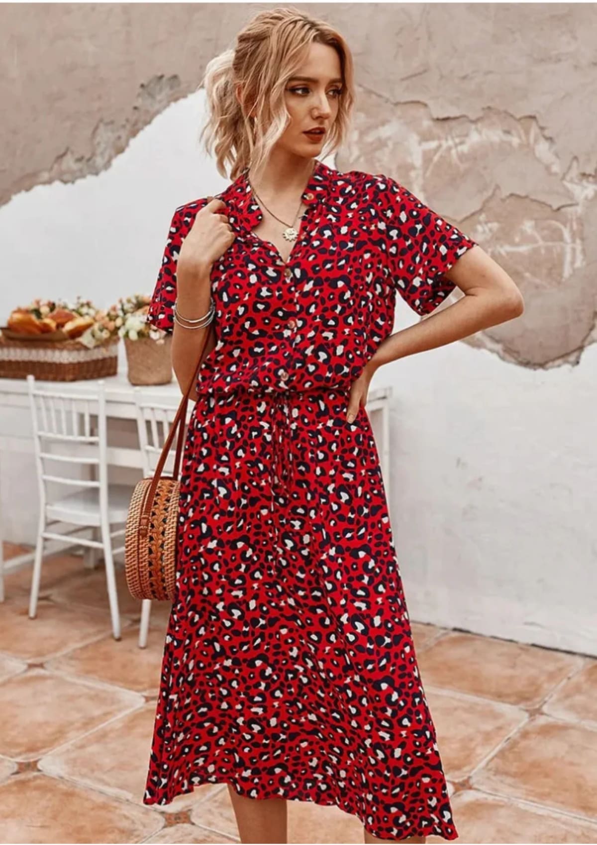 Spotted midi dress with button-down front and drawstring waist.