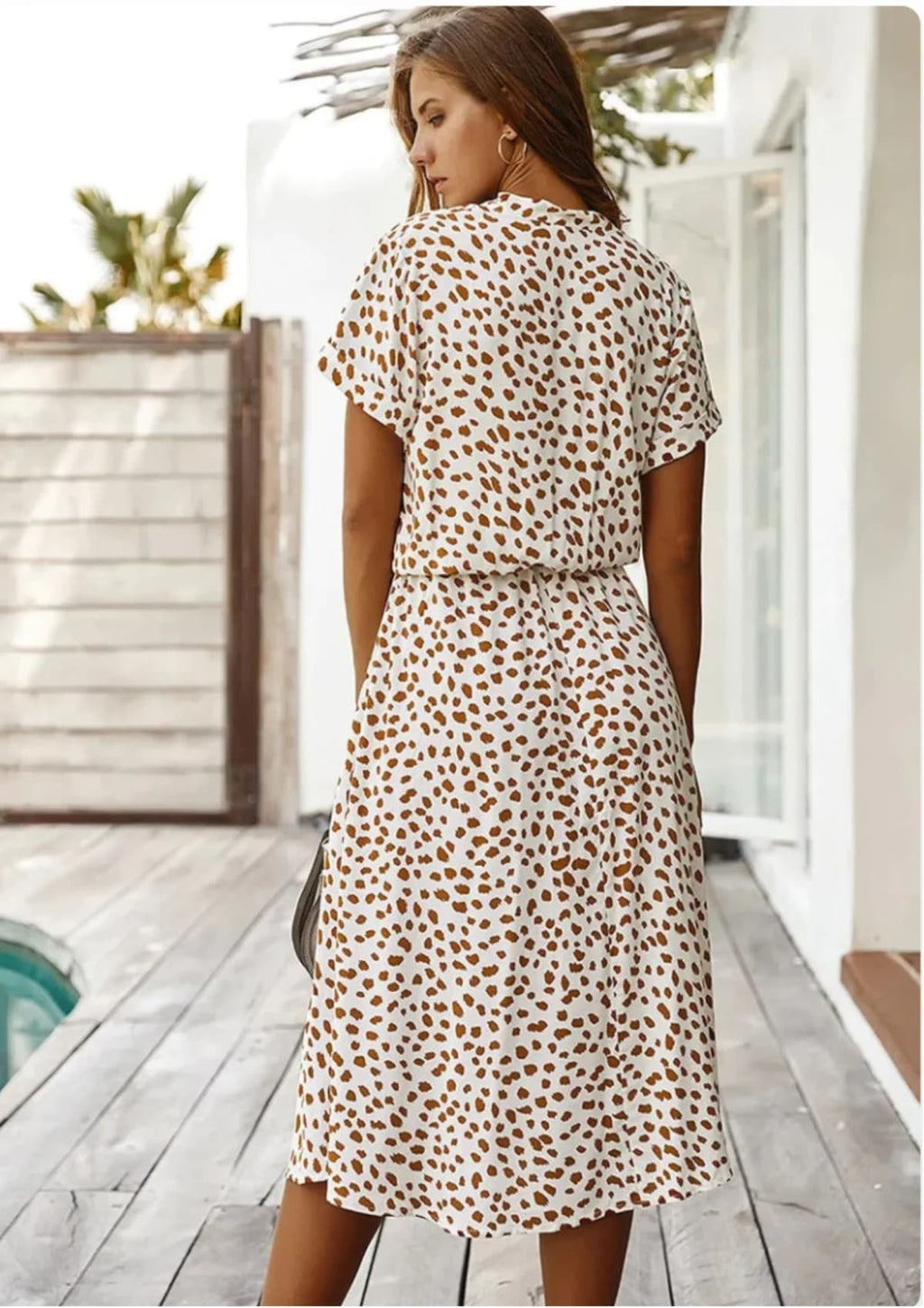 Spotted midi dress with button-down front and drawstring waist.
