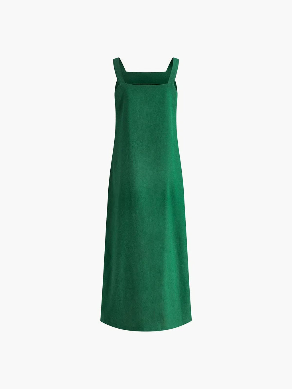 Woman in square neck midi dress with side slit against tiled wall.