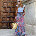 Paisley print tiered maxi skirt in vibrant colors, high-waisted.