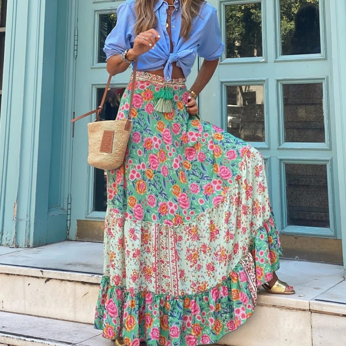 Paisley print tiered maxi skirt in vibrant colors, high-waisted.