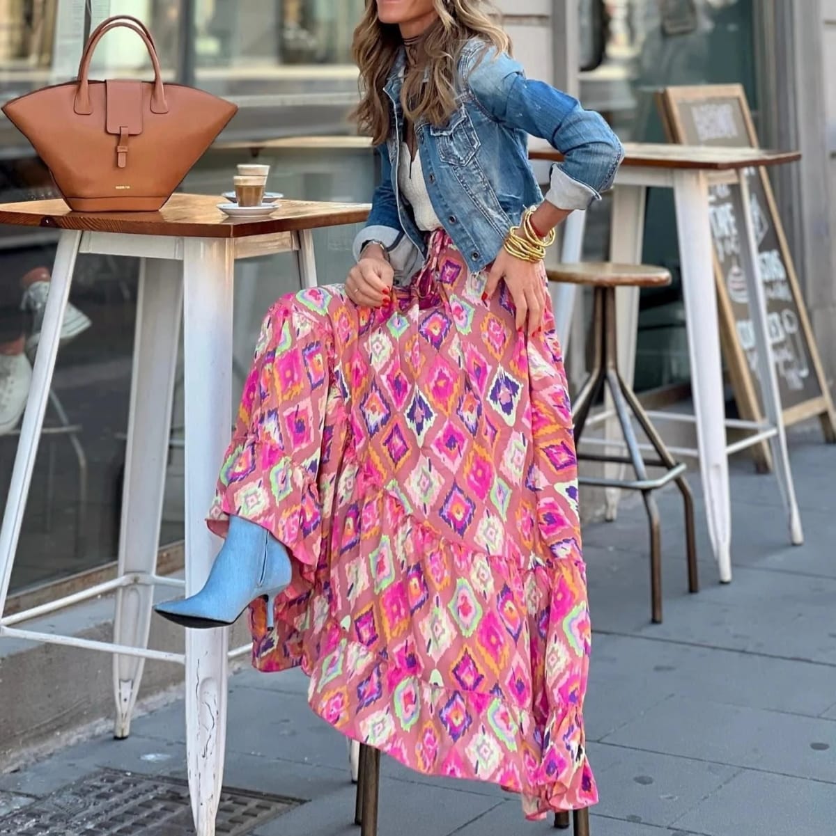 Paisley print tiered maxi skirt in vibrant colors, high-waisted.