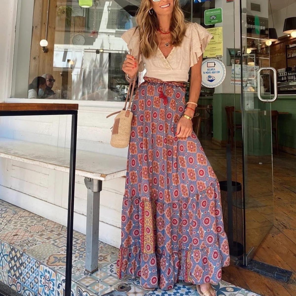 Paisley print tiered maxi skirt in vibrant colors, high-waisted.