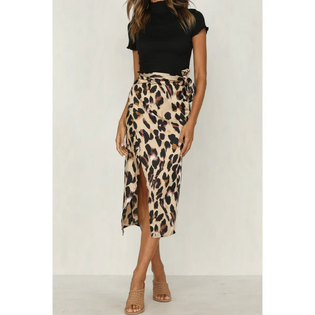 Close-up of a leopard print wrap midi skirt with a high slit.