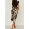 Close-up of a leopard print wrap midi skirt with a high slit.