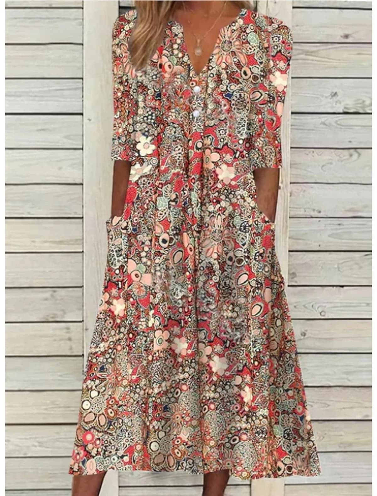Draped summer dress with V-neck and relaxed fit.