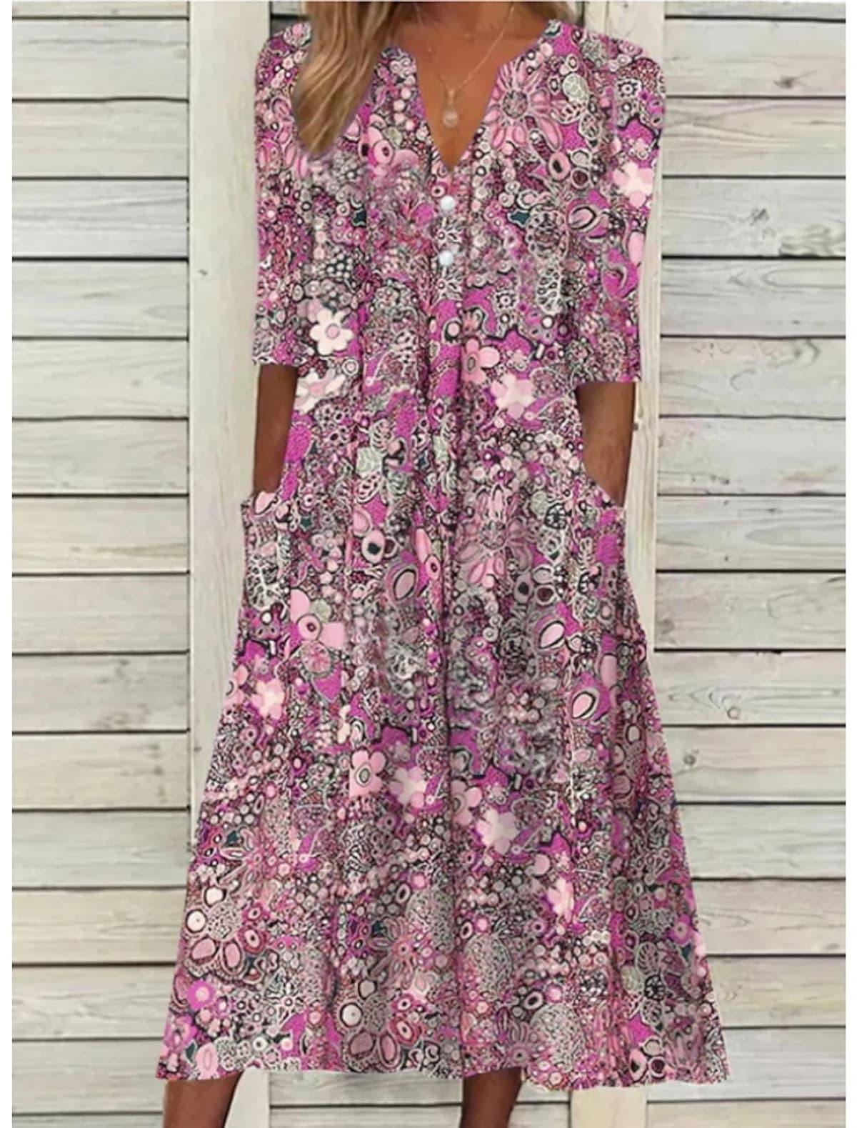 Draped summer dress with V-neck and relaxed fit.