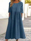 A-line dress with relaxed cut and soft fabric, styled for spring.