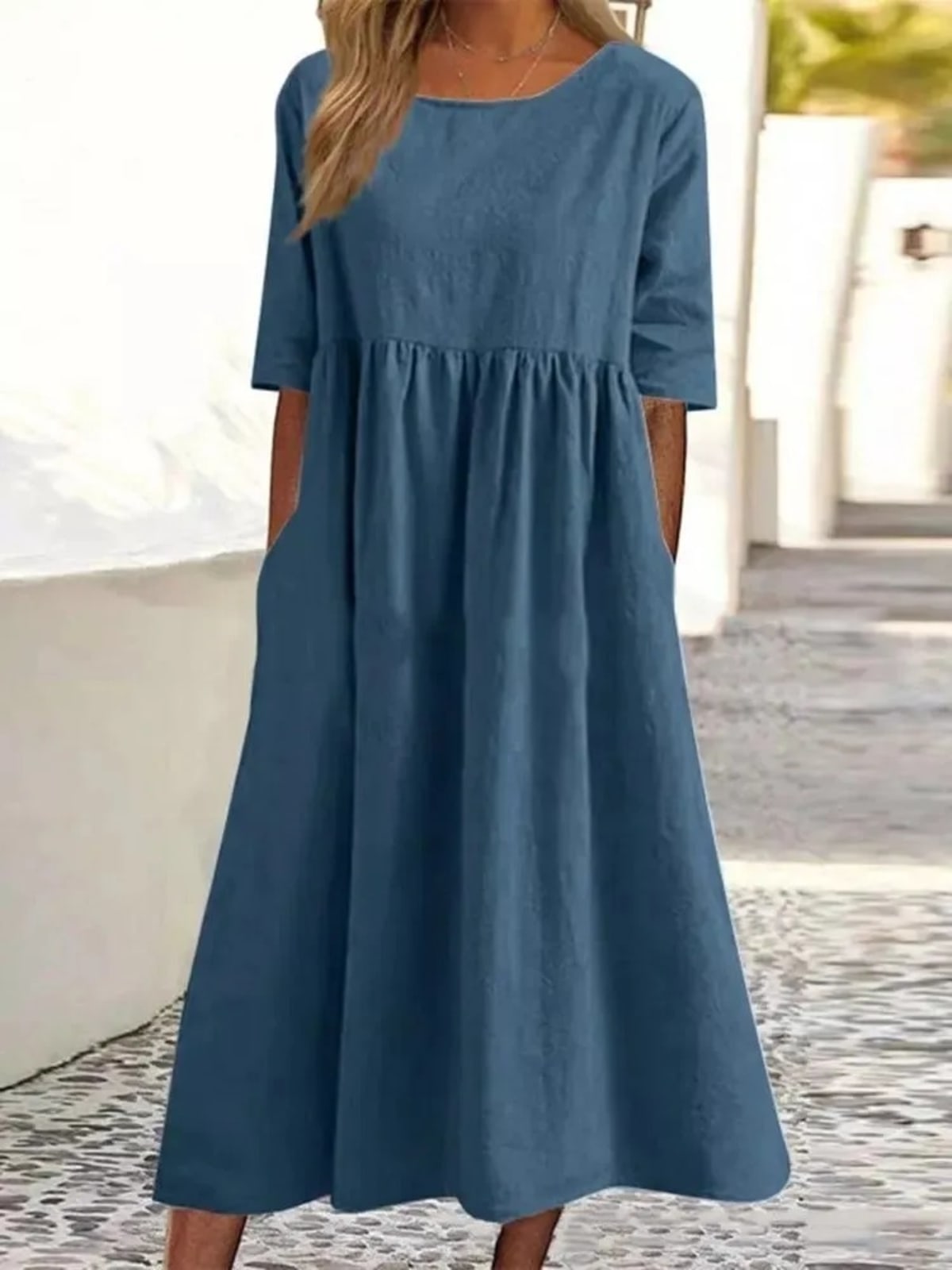 A-line dress with relaxed cut and soft fabric, styled for spring.
