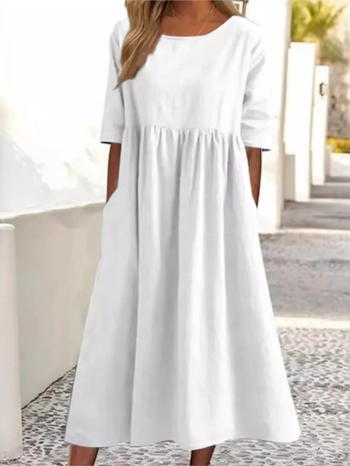 A-line dress with relaxed cut and soft fabric, styled for spring.