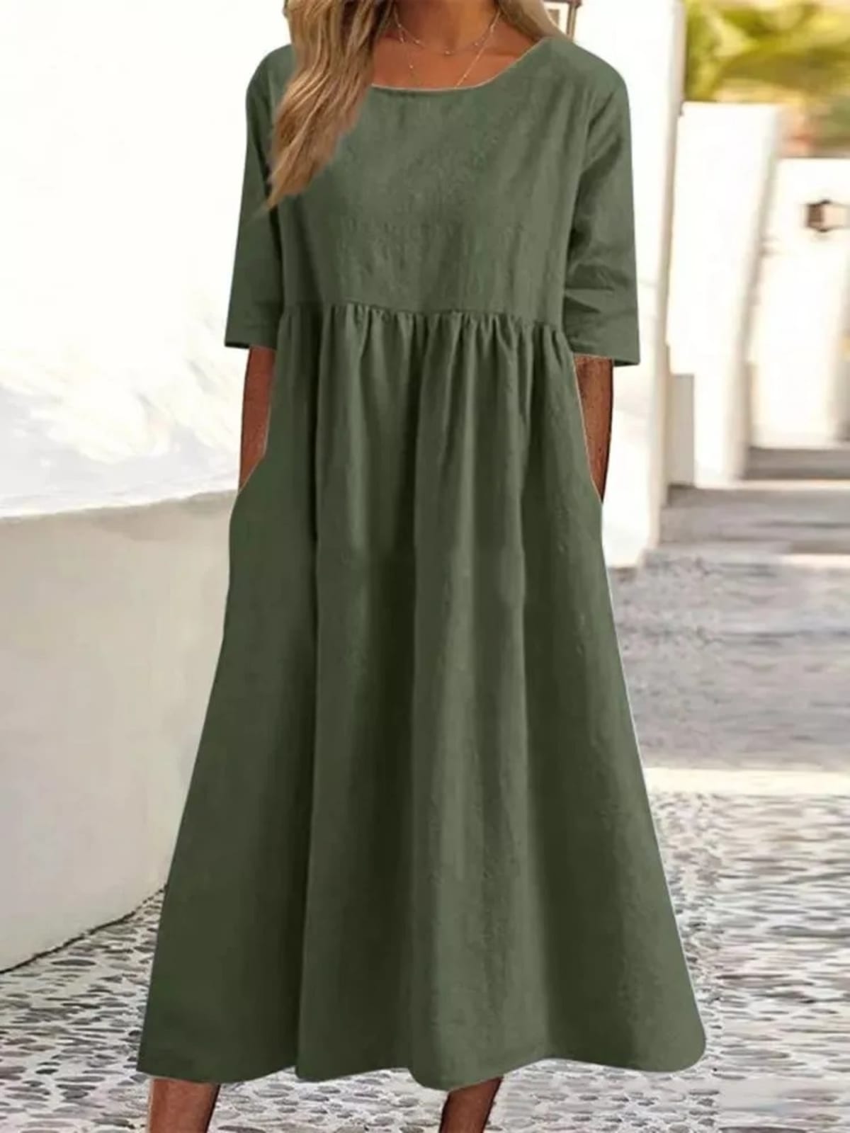 A-line dress with relaxed cut and soft fabric, styled for spring.